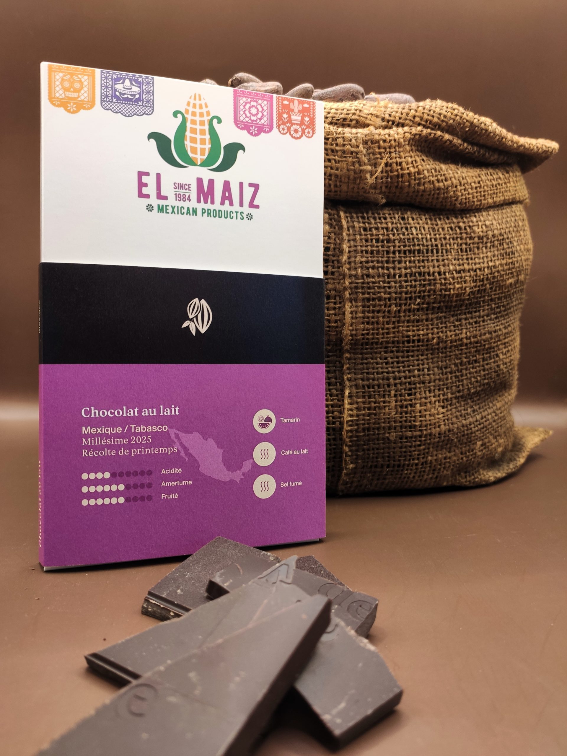Une tablette de chocolat blanche et rose sur laquel on peut lire "El Maiz, Mexian products, since 1984".